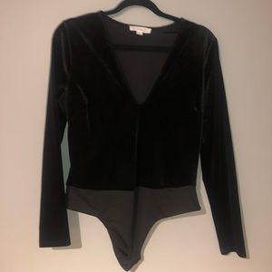 Black velvet long sleeved body suit
